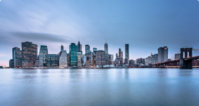 river in front of a skyline of a city